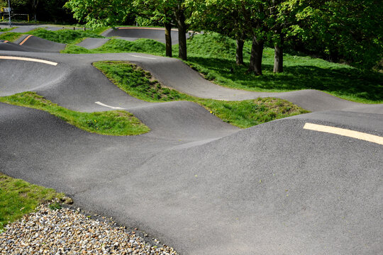 Bike track for riding bmx or mountain bikes with jumps and corners to cycle over on a smooth surface for sporting and race events