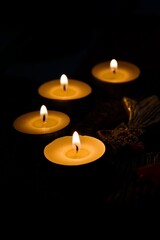 Four Lit Candles on Rustic Ceramic Advent Wreath