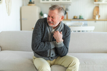 Pain on heart, heart attack. Unhappy middle aged senior man suffering from chest pain heart attack...