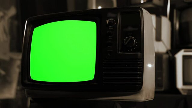 An Old TV Turning On Chroma Key Green Screen. Sepia Tone. Dolly Shot. 4K Resolution.