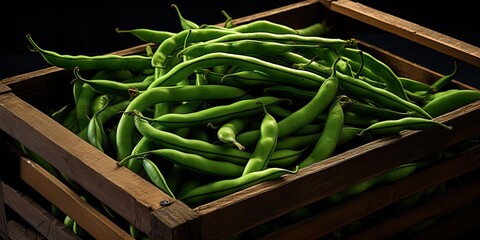Green beans in a wooden box. Selective focus. Toned.
