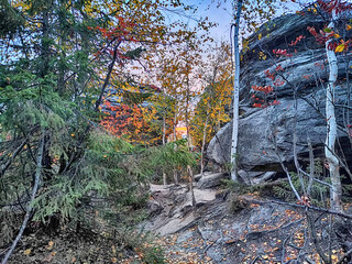 Landscape with huge gray boulders and sunset in evening. Natural Stone City in Yekaterinburg....