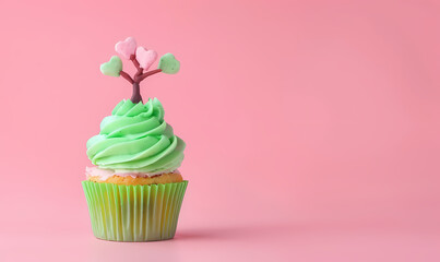 Cupcake with pink background, frosting and green color