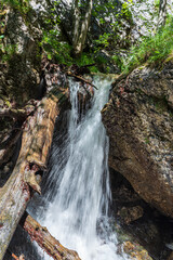 Waterfall between rocks in Janosikove diery in Mala Fatra mountains in Slovakia