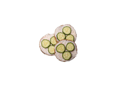 Delicious vegetarian sandwich with grilled toast, cream cheese, cucumbers and seeds
