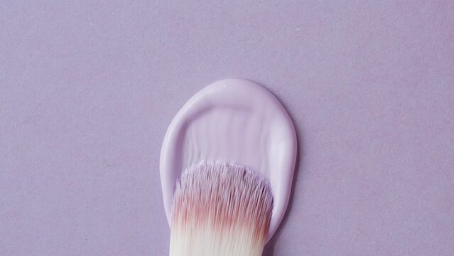 Beauty shop, Foundation face make-up close up smudge, smear. Cosmetic liquid foundation cream beige color smudge smearing. 