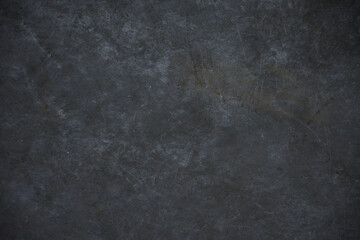 The black stone background has scratch marks. - obrazy, fototapety, plakaty