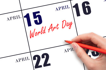 April 15. Hand writing text World Art Day on calendar date. Save the date.