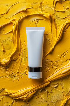 Mockup of blank white cream or mask tube on creamy yellow background. Concept and design for women's face care cosmetics