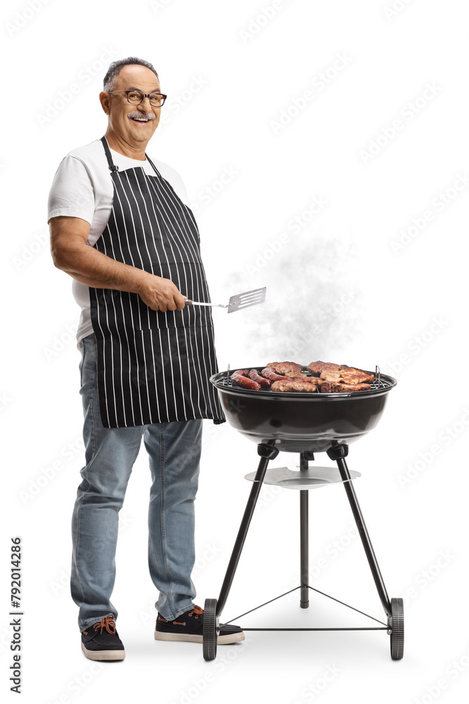 Poster Mature man making a barbecue