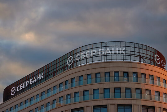 Minsk, Belarus. Oct 6, 2022.  Luminous sign and logo of the Russian bank Sberbank on tooftop of the modern building in Minsk