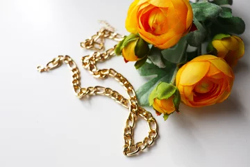 Foto op Plexiglas postcard layout. bouquet of flowers and gold jewelry © Palanga