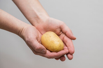 Potato Lover: Caucasian man Holding a Melody Potato