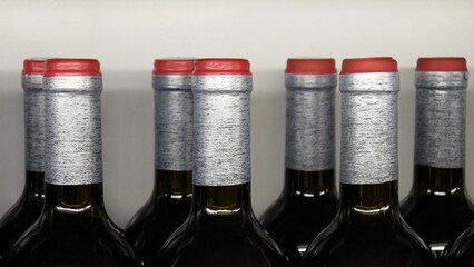 Close-up of many beautiful red wine bottles