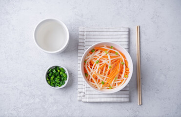 Daikon radish carrot noodles salad in a bowl