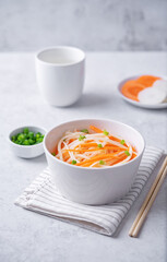 Daikon radish carrot noodles salad in a bowl