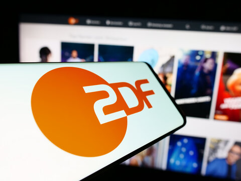 Stuttgart, Germany - 04-10-2024: Cellphone with logo of television broadcaster Zweites Deutsches Fernsehen (ZDF) in front of website. Focus on center of phone display.