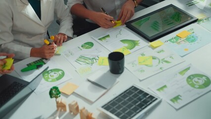 Close up of team hand brainstorming and planning about environmental investment. Project manager...