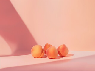 Three apricots with plant shadows on a pastel pink background. Concept of natural light, freshness, and summer fruits. Design for product display, healthy food advertisement, and culinary poster with 