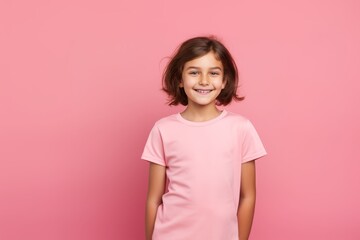 Fototapeta premium Happy Girl in Pink Shirt on Pink Background. Generative AI.
