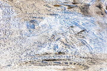 abstract background of white snow with traces of skiers on a sunny day - obrazy, fototapety, plakaty