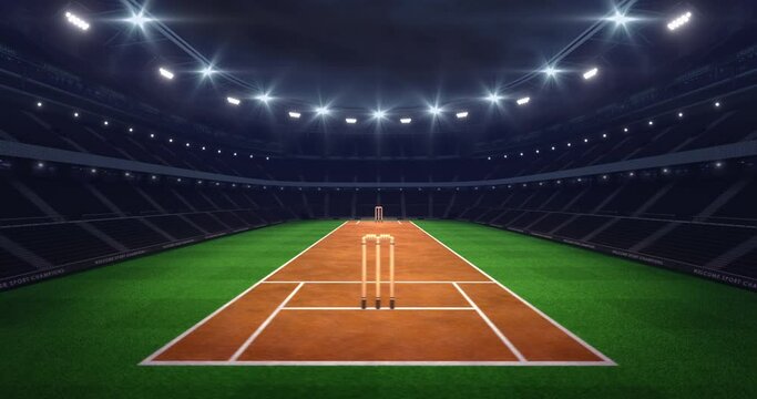 Spectacular stadium at night and illuminated cricket field ready to start match. Professional 4k video as sports background. Camera is rotating around field in animation loop.