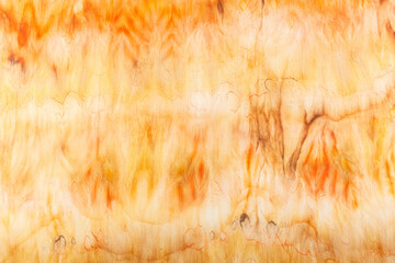 abstract pattern on silk fabric texture in yellow and brown tones