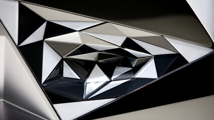 Background material photo showing a close-up of a three-dimensional structure composed of shining triangular surfaces