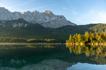 Lake eibsee at dawn with still water reflection