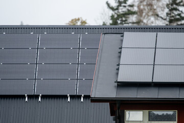 Two roofs with solar panels.