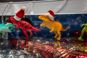 Toy dinosaurs with christmas theme in a shop.