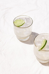 Margarita Soda Water Beverage Summertime Cocktail with Lime on Solid Bright White Background