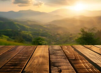 Wooden table top with blurred landscape background of green hills and mountain range at sunrise - Powered by Adobe