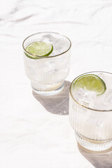 Margarita Soda Water Beverage Summertime Cocktail with Lime on Solid Bright White Background