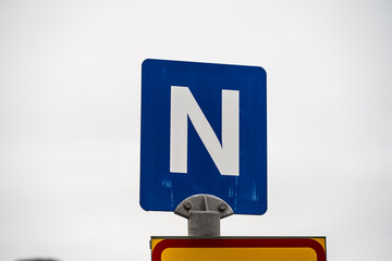 N sign on top of a pole.