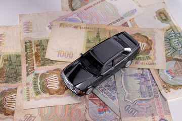 Black car on russian ruble bank notes.