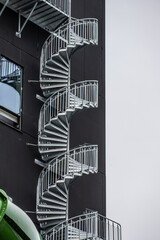 Escape staircase outside a tall building.