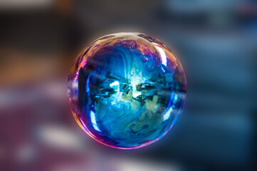 Reflections and prism effect on a soap bubble