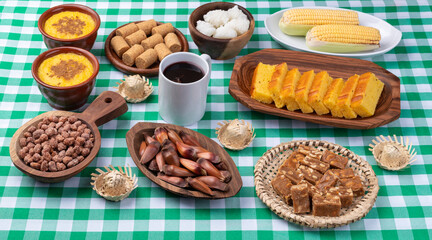 Typical brazilian june festival food over plaid fabric. Festa junina