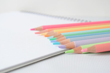 Pastel colored pencils on a white background