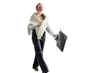 A woman smiling walking in a fashionable shirt with a bag, cut out background