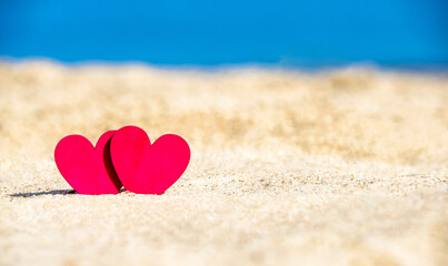 romantic symbol of two hearts on the beach
