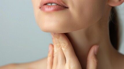 portrait showing the fingers squeezing flabbiness adipose hanging skin under the neck, problem wrinkles and cellulite under the chin of the woman, concept health care.


