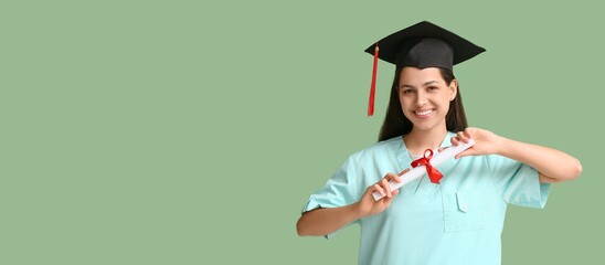 Female medical graduating student on green background with space for text