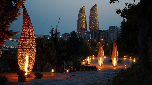 The illuminated flame towers and martyr's mosque seen from highland park, dagustu park in Baku, Azerbaijan.

