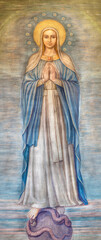 Fototapeta premium MILAN, ITALY - MARCH 7, 2024: The fresco of Immaculate Conception in the church Chiesa di San Vito in Gianbellino by Antonio Martinotti (1957).