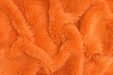 Bright orange faux fur texture, fabric background