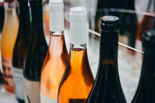 Different bottles of wine ready for wine tasting in a bar or restaurant or wine expo.