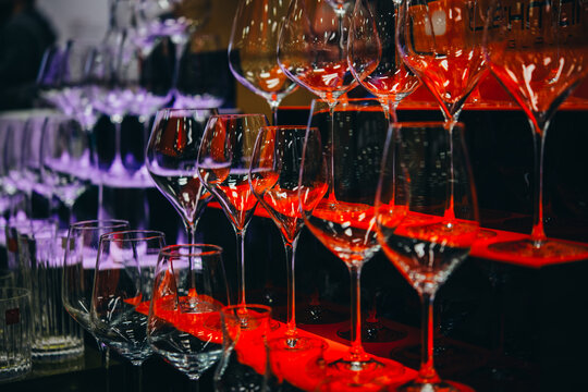 Different wine glasses ready for wine tasting in a bar of restaurant or wine expo.