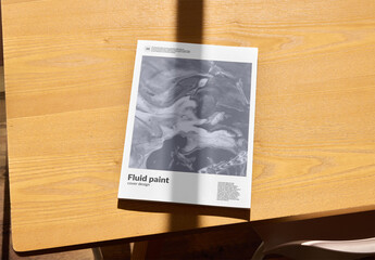 Mockup of vertical A4 paperback magazine with customizable front cover